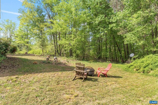1842 Ed Jones Rd, Scottsville, VA 24590 - view of green lawn with a fire pit