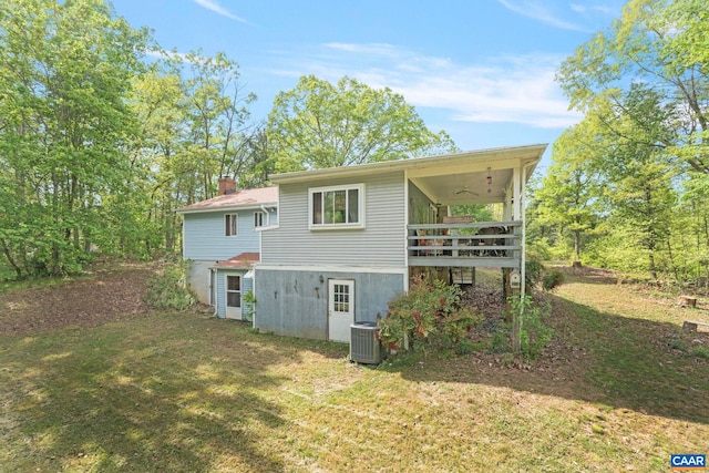 1842 Ed Jones Rd, Scottsville, VA 24590 - rear view of house featuring central AC, a lawn, a ceiling fan, and a chimney