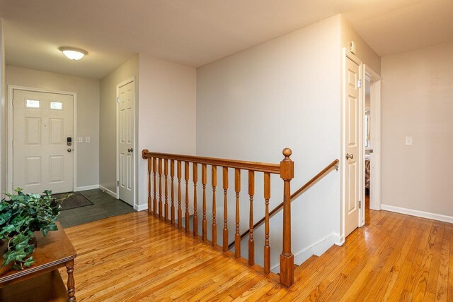 entrance foyer with hardwood / wood-style floors and baseboards
