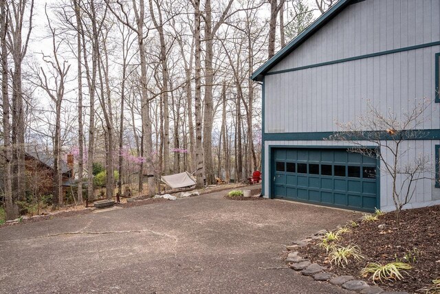 view of home's exterior with asphalt driveway