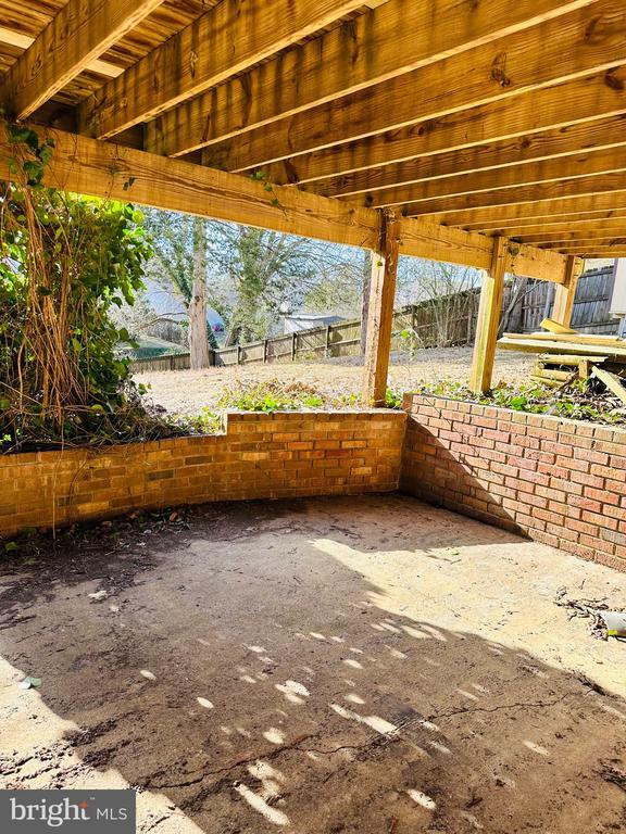 view of patio featuring fence