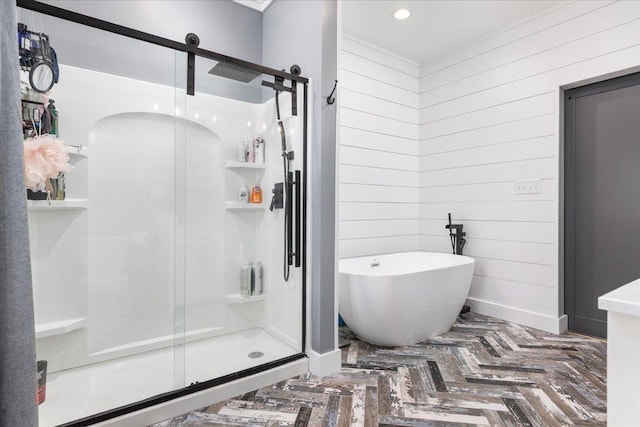845 Forrest Dr, Stanley, VA 22851 - bathroom with a stall shower, recessed lighting, wooden walls, and a freestanding tub