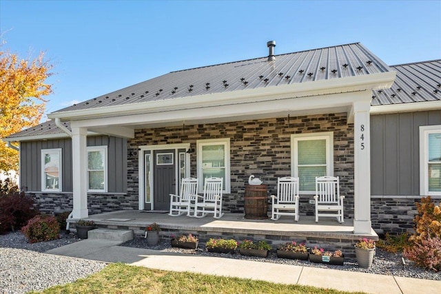 845 Forrest Dr, Stanley, VA 22851 - rear view of property with a porch, metal roof, stone siding, and board and batten siding
