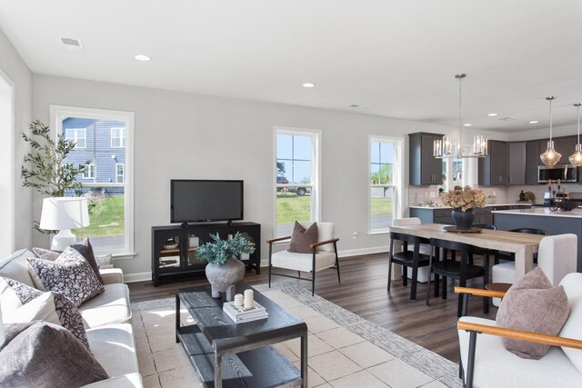 2910 Rutlege Rd Unit 175, Rockingham, VA 22801 - living room featuring a chandelier, recessed lighting, dark wood finished floors, and baseboards