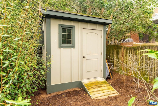 view of shed with fence