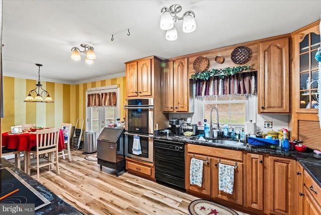 kitchen featuring a chandelier, black appliances, light wood-style flooring, glass insert cabinets, and brown cabinets