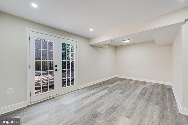 interior space featuring baseboards, french doors, recessed lighting, and wood finished floors