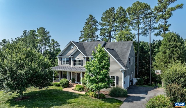 2 Forest Ct, Zion Crossroads, VA 22942 - traditional-style home with driveway, a porch, a front lawn, and an attached garage