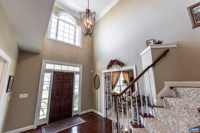 2 Forest Ct, Zion Crossroads, VA 22942 - entryway with a chandelier, dark wood-style flooring, a towering ceiling, stairway, and ornamental molding