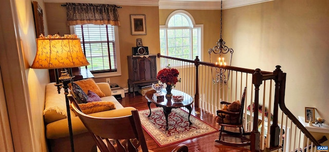 2 Forest Ct, Zion Crossroads, VA 22942 - sitting room with wood finished floors, a chandelier, ornamental molding, and an upstairs landing
