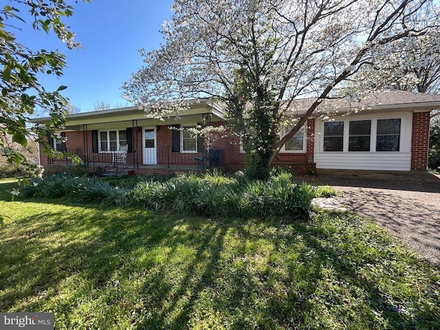 14172 Hicks Ln, Gordonsville, VA 22942 - view of front facade with brick siding, a front lawn, and a porch