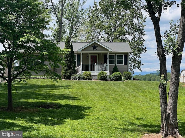 view of front of house with covered porch and a front yard