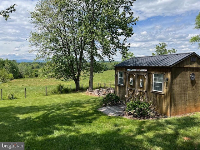 view of yard with an outdoor structure and a shed