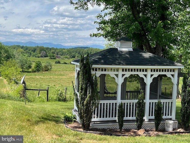 view of community featuring a gazebo and a mountain view