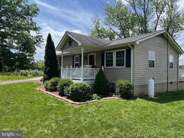view of front of property with a porch and a front yard