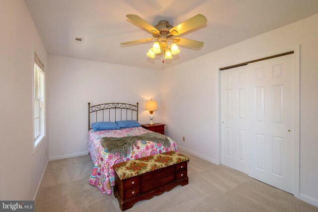 11523 Red Rock Ln, Bumpass, VA 23024 - carpeted bedroom featuring a closet and ceiling fan