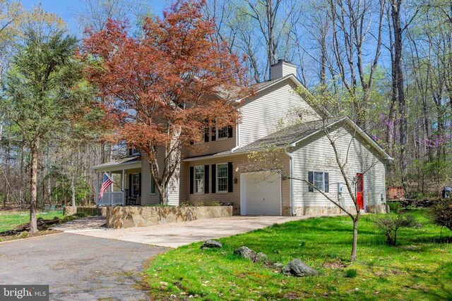 11523 Red Rock Ln, Bumpass, VA 23024 - view of front of property featuring driveway, a chimney, an attached garage, a porch, and a front lawn