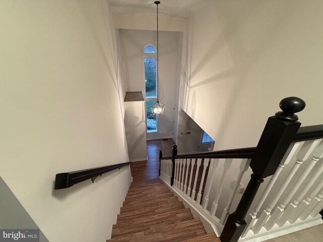 11523 Red Rock Ln, Bumpass, VA 23024 - stairs featuring wood finished floors and a towering ceiling