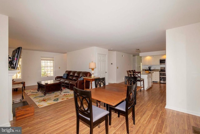 11523 Red Rock Ln, Bumpass, VA 23024 - dining room with light wood-style flooring and baseboards
