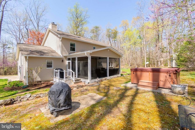 11523 Red Rock Ln, Bumpass, VA 23024 - rear view of property with a hot tub, a sunroom, and a chimney