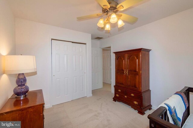11523 Red Rock Ln, Bumpass, VA 23024 - bedroom featuring light colored carpet, a closet, and ceiling fan