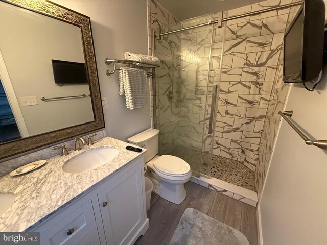 11523 Red Rock Ln, Bumpass, VA 23024 - full bathroom with a stall shower, wood finished floors, and vanity