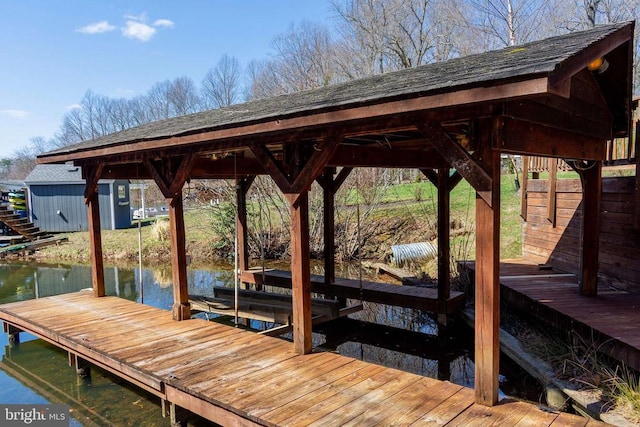 11523 Red Rock Ln, Bumpass, VA 23024 - dock featuring boat lift and a water view