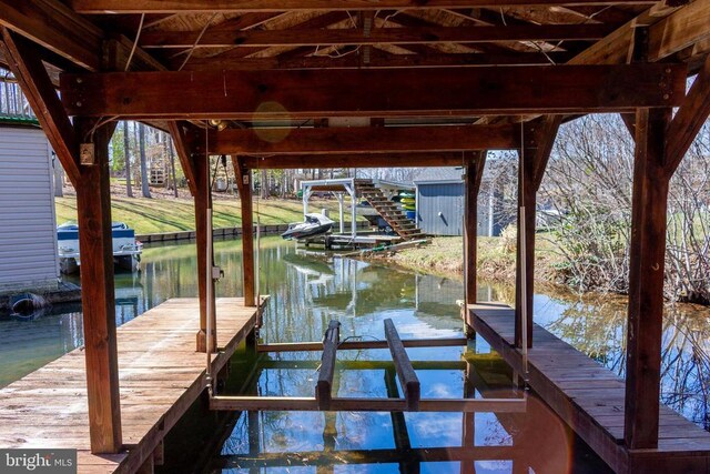 11523 Red Rock Ln, Bumpass, VA 23024 - dock featuring boat lift and a water view