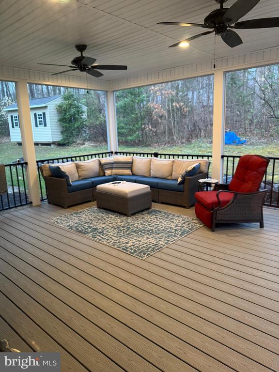 11523 Red Rock Ln, Bumpass, VA 23024 - wooden terrace featuring a ceiling fan and an outdoor hangout area