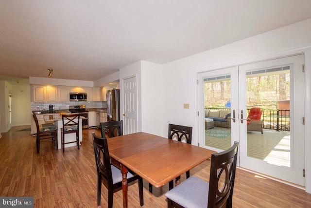 11523 Red Rock Ln, Bumpass, VA 23024 - dining area featuring wood finished floors and french doors