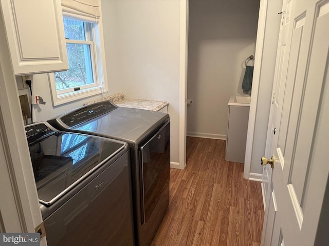 11523 Red Rock Ln, Bumpass, VA 23024 - washroom featuring separate washer and dryer, wood finished floors, and cabinet space