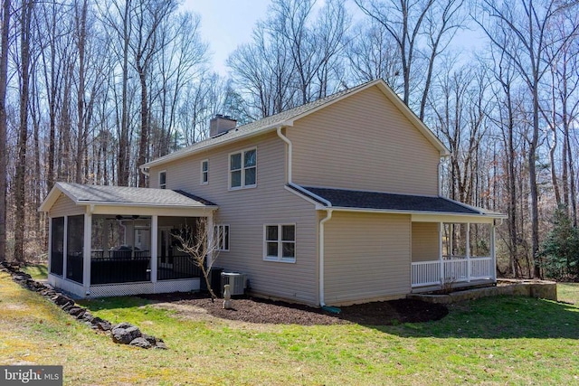 11523 Red Rock Ln, Bumpass, VA 23024 - back of house featuring a sunroom, a yard, a porch, a chimney, and ceiling fan