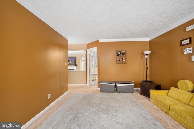 13104 Willow Point Dr, Fredericksburg, VA 22408 - carpeted living area with ornamental molding, a textured ceiling, and baseboards