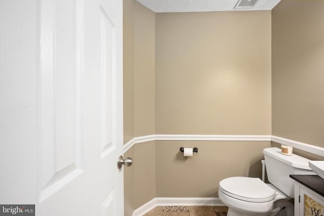 13104 Willow Point Dr, Fredericksburg, VA 22408 - half bathroom featuring toilet, baseboards, tile patterned flooring, and vanity