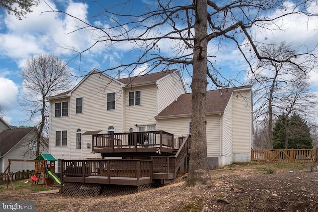 13104 Willow Point Dr, Fredericksburg, VA 22408 - rear view of property with a deck, fence, a playground, and roof with shingles