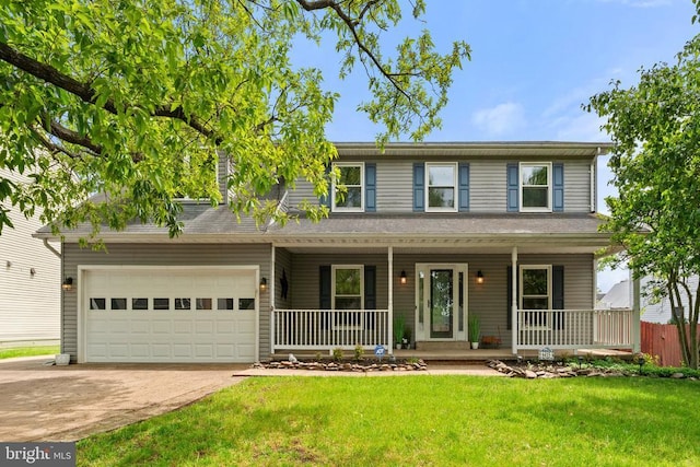 view of front of house featuring covered porch, driveway, and an attached garage