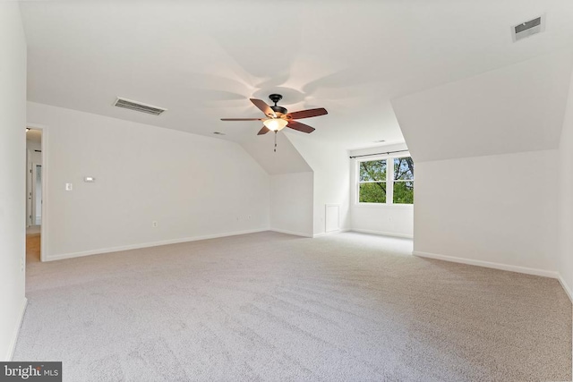 bonus room with a ceiling fan, carpet floors, baseboards, and lofted ceiling
