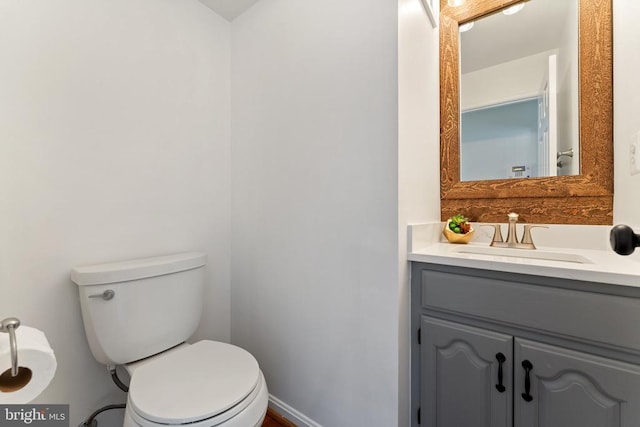 bathroom with toilet and vanity