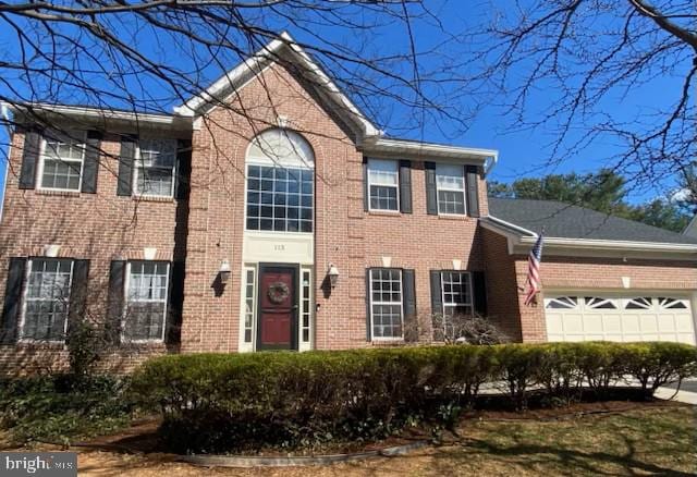 view of front of house with brick siding and an attached garage