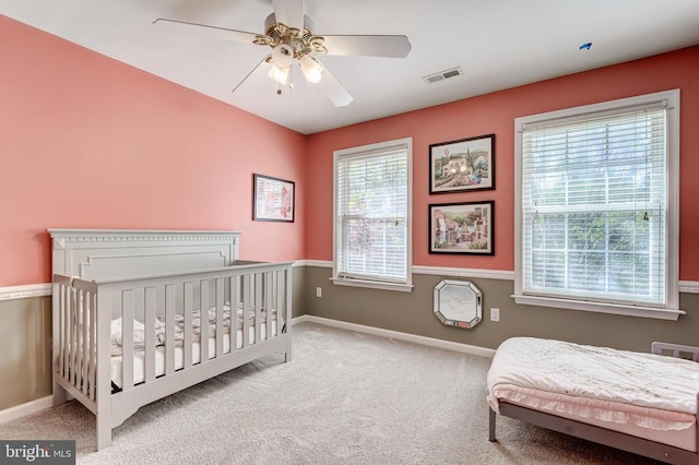 bedroom featuring carpet, baseboards, and a ceiling fan