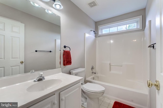 bathroom featuring toilet, tile patterned flooring, vanity, and shower / tub combination
