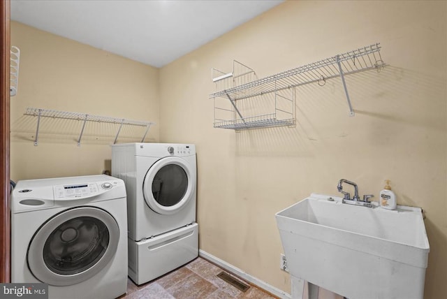 12017 Stonehenge Dr, Fredericksburg, VA 22407 - washroom with separate washer and dryer and baseboards