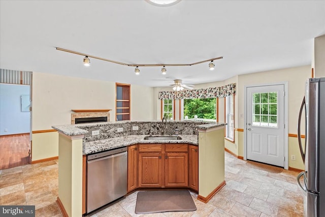 12017 Stonehenge Dr, Fredericksburg, VA 22407 - kitchen with stainless steel appliances, track lighting, light stone countertops, and ceiling fan