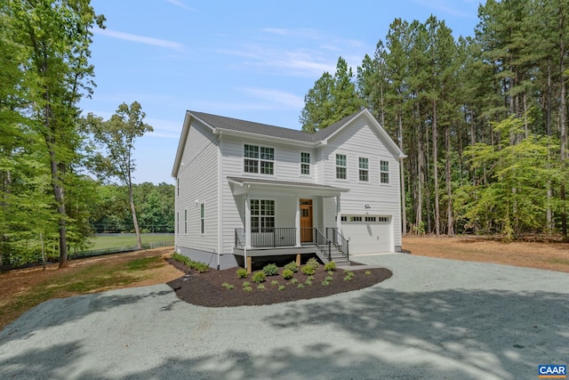 3 Lonicera Way, Charlottesville, VA 22911 - view of front facade with covered porch, a garage, and gravel driveway
