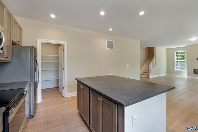 3 Lonicera Way, Charlottesville, VA 22911 - kitchen with dark countertops, visible vents, and light wood-style flooring