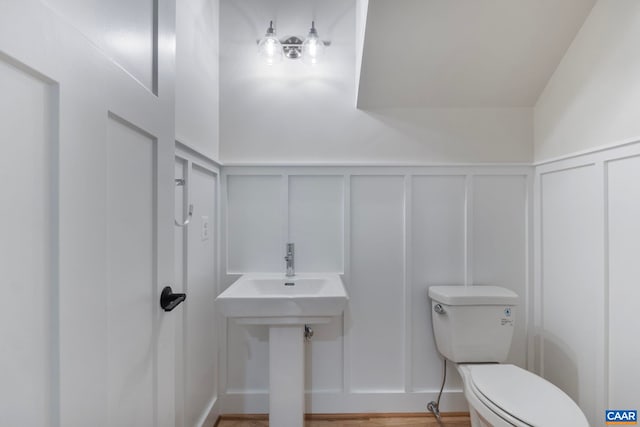 3 Lonicera Way, Charlottesville, VA 22911 - bathroom featuring wainscoting, toilet, and a decorative wall