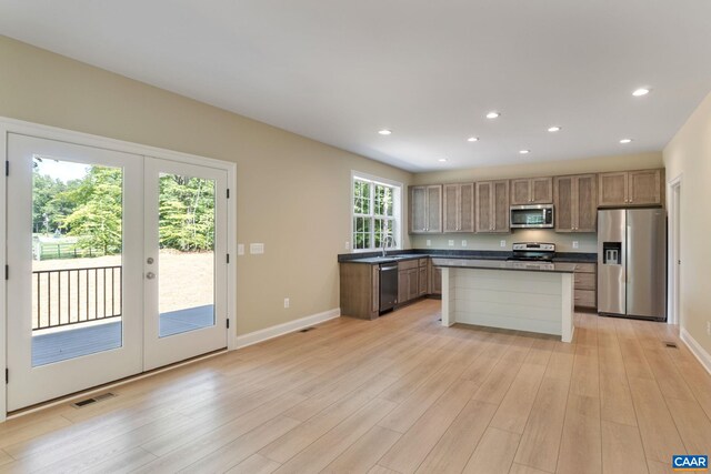 3 Lonicera Way, Charlottesville, VA 22911 - kitchen with light wood finished floors, dark countertops, stainless steel appliances, and french doors