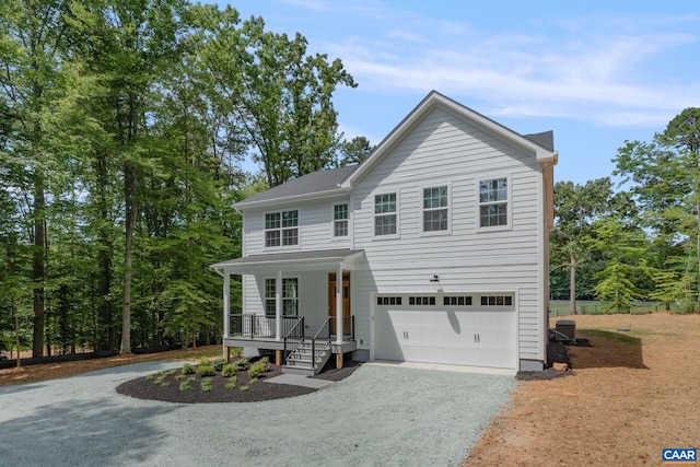 3 Lonicera Way, Charlottesville, VA 22911 - view of front of property with a porch, an attached garage, and gravel driveway