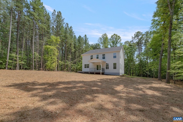 3 Lonicera Way, Charlottesville, VA 22911 - colonial inspired home featuring a wooded view and a wooden deck