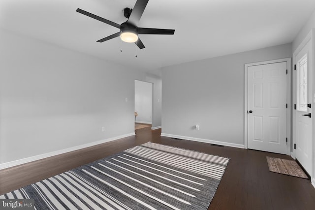 13179 Scotts Mill Rd, Culpeper, VA 22701 - unfurnished bedroom with dark wood-style floors, baseboards, and ceiling fan